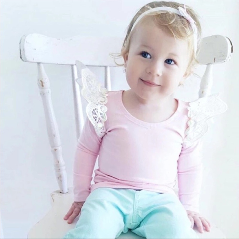 Cute pink shirt with ruffle lace detail on sleeve